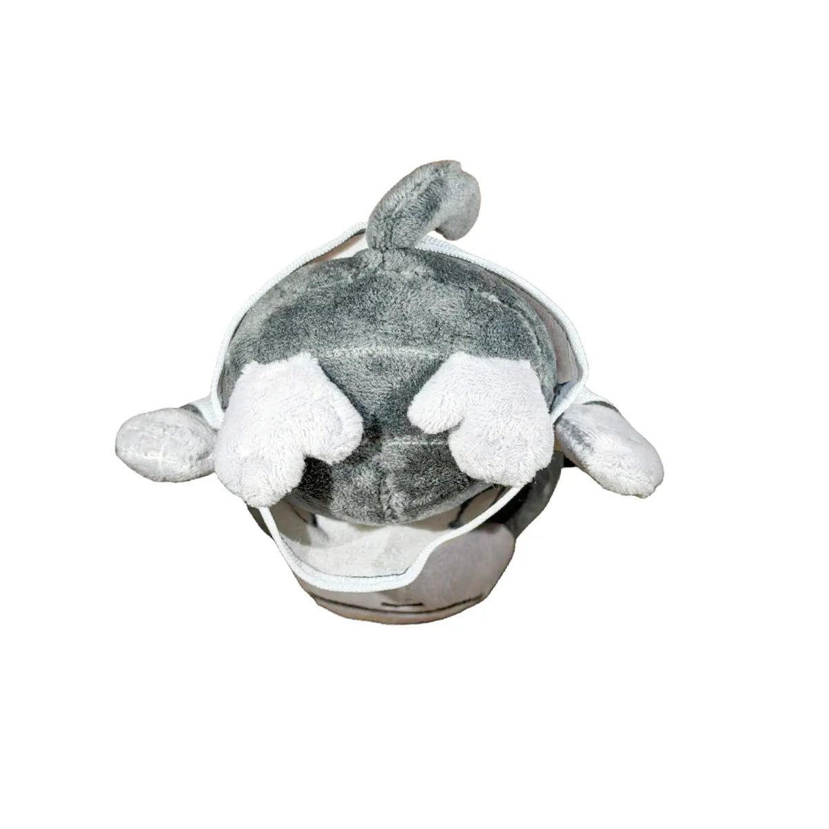 A plush monkey toy wearing a white shirt with black circular graphics and a small blue accent, photographed against a plain white background.