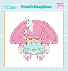 A chibi-style plushie illustration of Usagichan with long pink bunny ears, a white bow, and a light blue outfit, centered on a white card with a pale blue grid border. Text at the top reads 'Plushie Usagichan' and 'Ran Merch'.