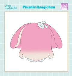 A pink plushie character design labeled 'Plushie Usagichan' with a white bow, shown on a light blue grid background with 'Ran Merch' branding.